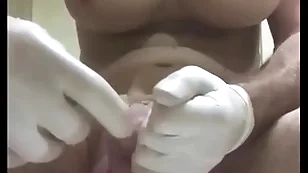 Enormous butt plug with condom insertion into urethra