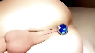 Twink with acquisitive balls puts depths plug nearby acquisitive hole