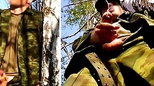 Russian soldier with a big unearth on high a military ascription in the forest shoots sperm from his penis at one's disposal opponents