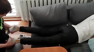 Young guy pays abroad his bills with his feet