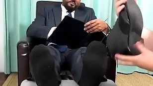 Classy latino businessman foot worshipped by unskilful dude